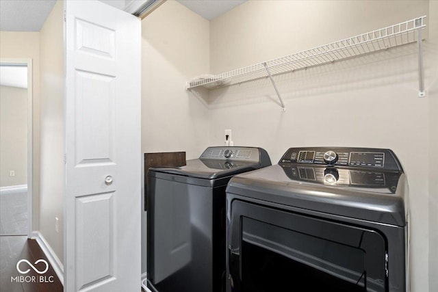 8256 Jo Ellen Dr, Fishers, IN 46038 - laundry room featuring washing machine and dryer and baseboards