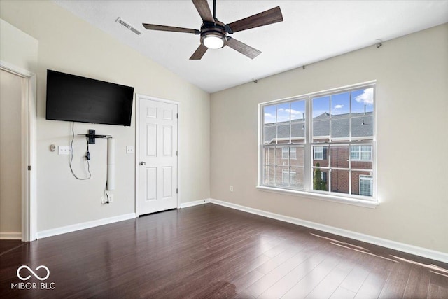 8256 Jo Ellen Dr, Fishers, IN 46038 - unfurnished bedroom with dark wood-style flooring, lofted ceiling, and a ceiling fan