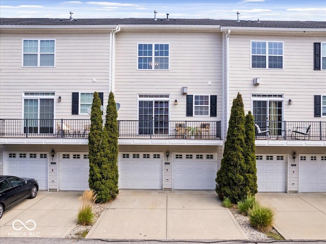 8256 Jo Ellen Dr, Fishers, IN 46038 - back of house with a garage and driveway