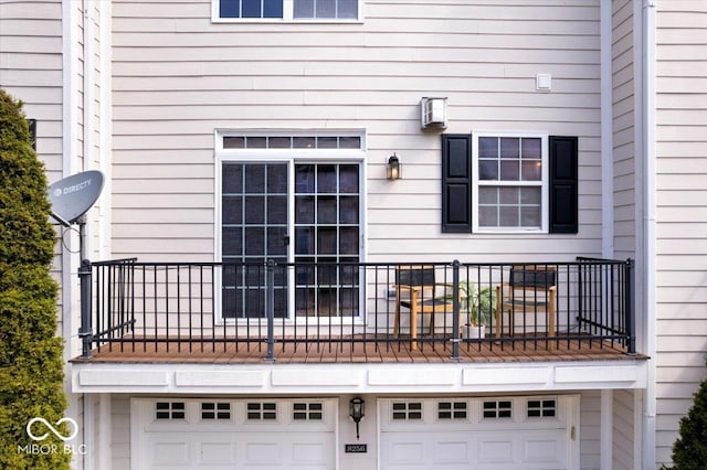 8256 Jo Ellen Dr, Fishers, IN 46038 - rear view of house with a garage and a balcony