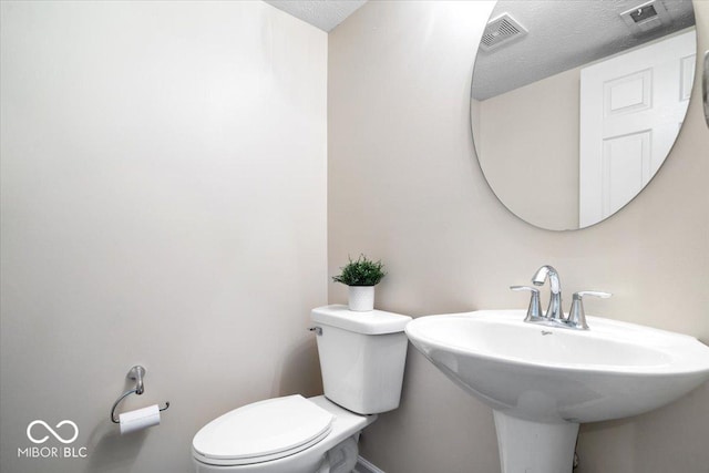 8256 Jo Ellen Dr, Fishers, IN 46038 - bathroom with toilet and a textured ceiling