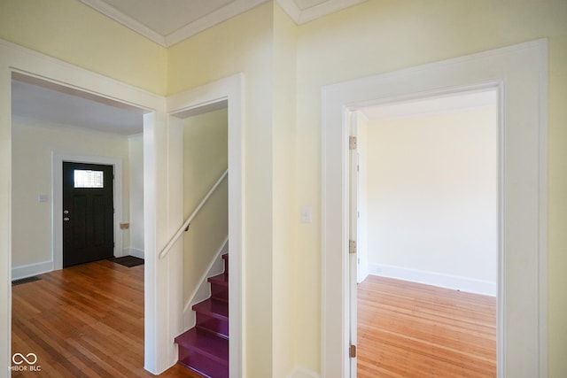 5050 Carrollton Ave, Indianapolis, IN 46205 - stairway featuring crown molding and wood finished floors