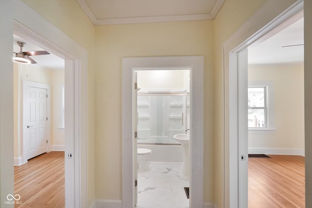 5050 Carrollton Ave, Indianapolis, IN 46205 - hallway with crown molding and light wood-style floors