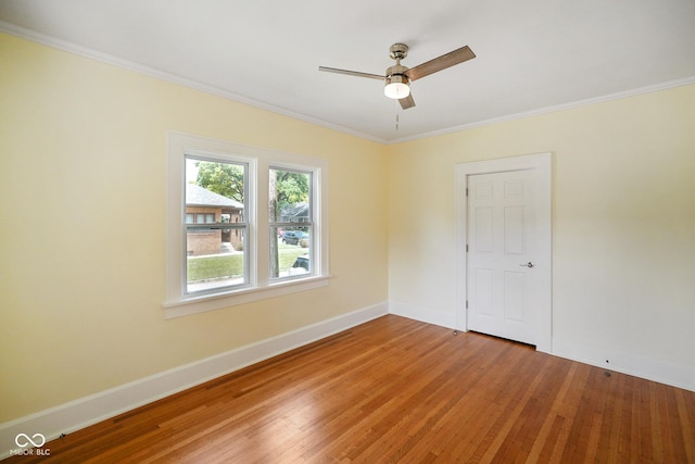 5050 Carrollton Ave, Indianapolis, IN 46205 - empty room with a ceiling fan, light wood-style floors, and crown molding