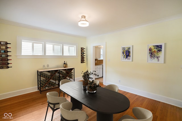 5050 Carrollton Ave, Indianapolis, IN 46205 - dining area featuring ornamental molding and light wood-style floors