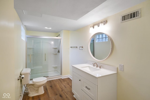 5050 Carrollton Ave, Indianapolis, IN 46205 - bathroom with vanity, a stall shower, and wood finished floors