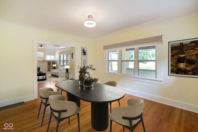 5050 Carrollton Ave, Indianapolis, IN 46205 - dining space featuring ornamental molding, wood finished floors, and a ceiling fan