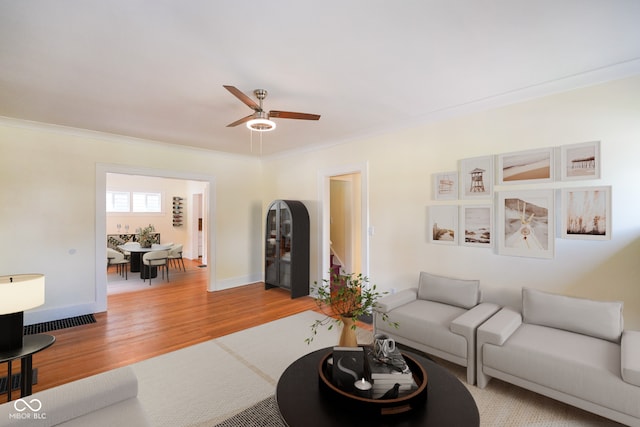5050 Carrollton Ave, Indianapolis, IN 46205 - living area with wood finished floors, crown molding, and a ceiling fan