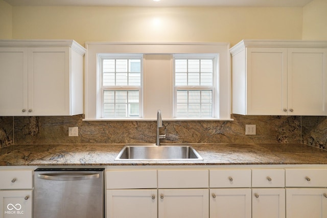 5050 Carrollton Ave, Indianapolis, IN 46205 - kitchen with dishwasher, white cabinetry, and tasteful backsplash