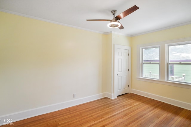 5050 Carrollton Ave, Indianapolis, IN 46205 - empty room with light wood-style flooring, a ceiling fan, and ornamental molding