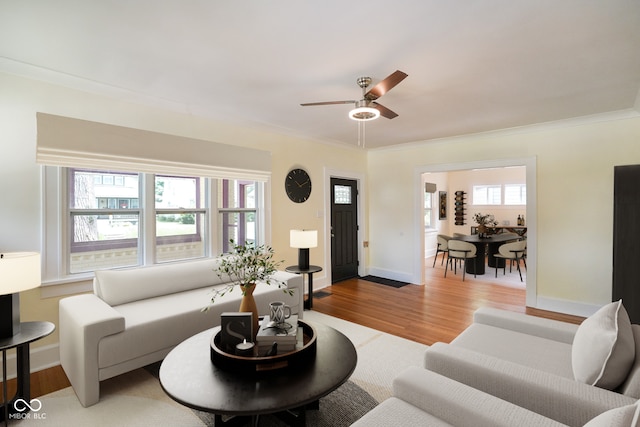 5050 Carrollton Ave, Indianapolis, IN 46205 - living room featuring ornamental molding, wood finished floors, and a ceiling fan