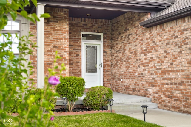 2533 Violet Way, Columbus, IN 47201 - doorway to property featuring brick siding and a porch