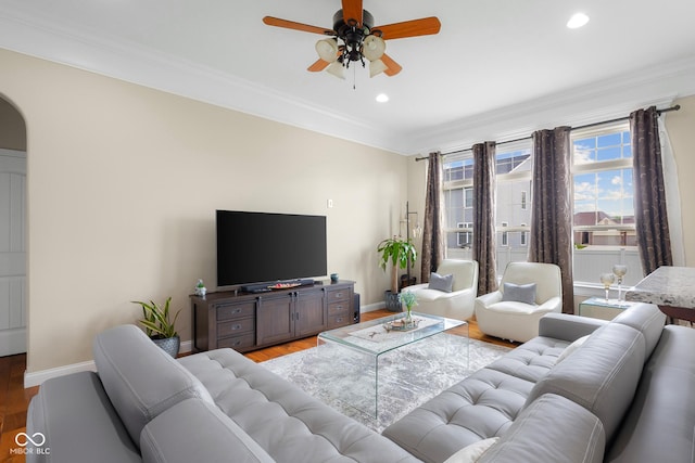 2533 Violet Way, Columbus, IN 47201 - living room with light wood-style flooring, ceiling fan, ornamental molding, recessed lighting, and arched walkways