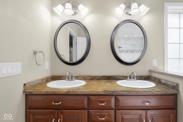2533 Violet Way, Columbus, IN 47201 - full bath with double vanity and a chandelier