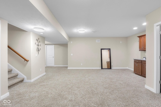 2533 Violet Way, Columbus, IN 47201 - unfurnished living room featuring light carpet, stairs, and recessed lighting