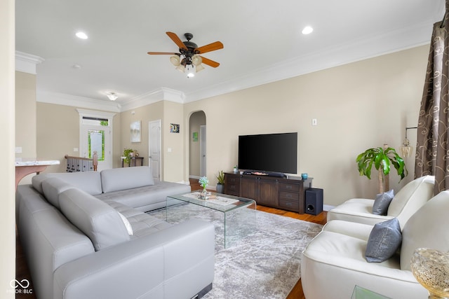 2533 Violet Way, Columbus, IN 47201 - living room featuring arched walkways, ceiling fan, wood finished floors, crown molding, and recessed lighting