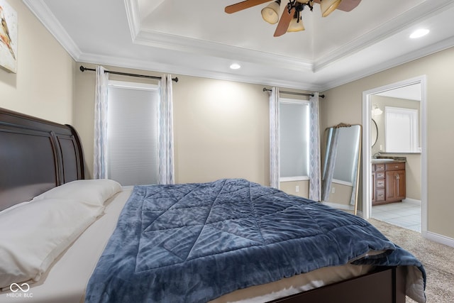 2533 Violet Way, Columbus, IN 47201 - carpeted bedroom featuring a tray ceiling, ornamental molding, recessed lighting, a ceiling fan, and connected bathroom