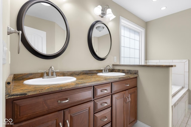 2533 Violet Way, Columbus, IN 47201 - bathroom featuring double vanity, tiled bath, and recessed lighting