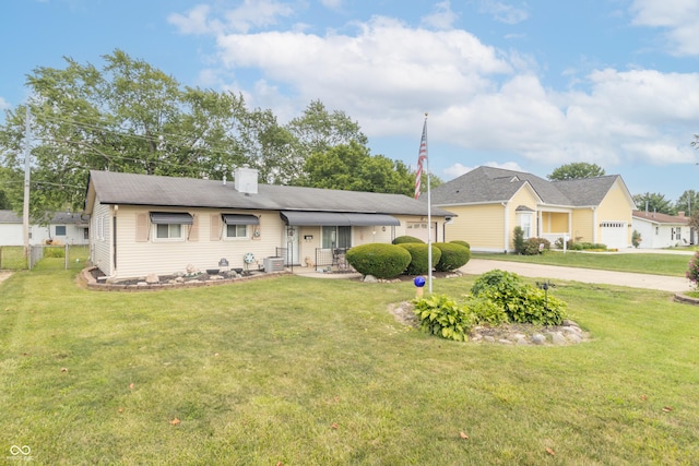 1003 N Broadway St, Greenfield, IN 46140 - single story home featuring a front lawn, concrete driveway, and a chimney