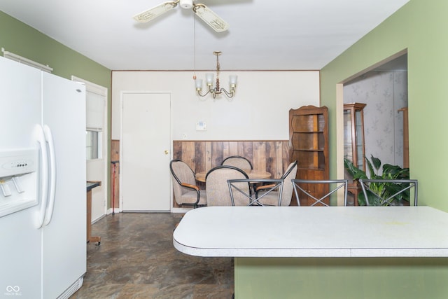 1003 N Broadway St, Greenfield, IN 46140 - kitchen featuring white refrigerator with ice dispenser, ceiling fan, a chandelier, light countertops, and decorative light fixtures