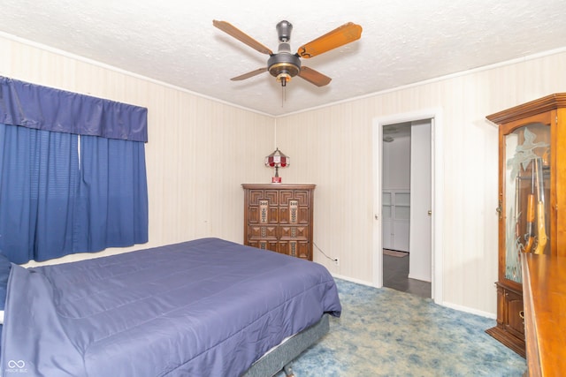 1003 N Broadway St, Greenfield, IN 46140 - bedroom with crown molding, carpet, a textured ceiling, ceiling fan, and wooden walls