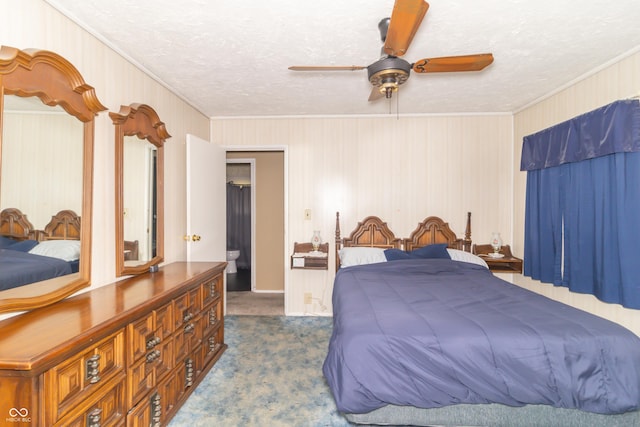 1003 N Broadway St, Greenfield, IN 46140 - bedroom featuring crown molding, carpet flooring, a textured ceiling, ceiling fan, and wooden walls