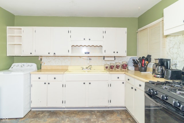 1003 N Broadway St, Greenfield, IN 46140 - kitchen featuring open shelves, washer / dryer, decorative backsplash, white cabinets, and light countertops