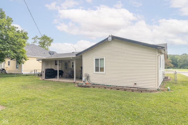 1003 N Broadway St, Greenfield, IN 46140 - rear view of house with a patio area and a fenced backyard