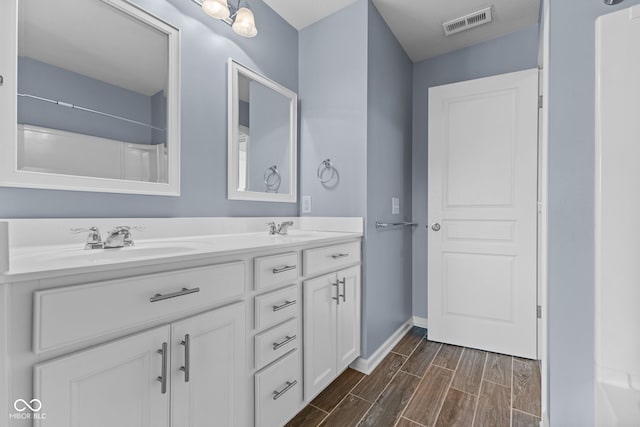 5398 Marigold Dr, Plainfield, IN 46168 - bathroom featuring double vanity and wood finished floors