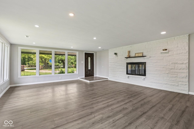 6233 Lafayette Rd, Indianapolis, IN 46278 - unfurnished living room with recessed lighting, a fireplace, and wood finished floors
