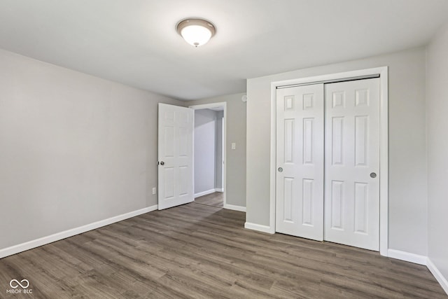 6233 Lafayette Rd, Indianapolis, IN 46278 - unfurnished bedroom featuring wood finished floors and a closet