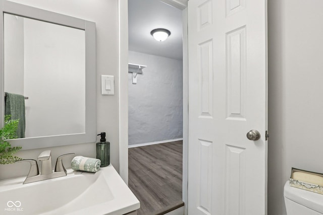 6233 Lafayette Rd, Indianapolis, IN 46278 - bathroom featuring a sink and wood finished floors