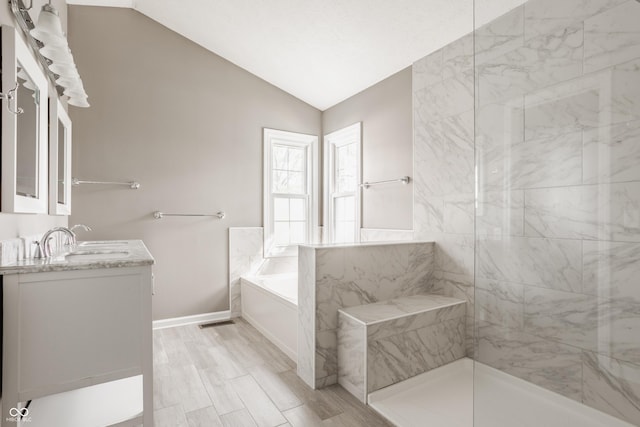 12861 Clifford Cir, Carmel, IN 46032 - bathroom featuring a bath, vanity, vaulted ceiling, walk in shower, and wood finished floors