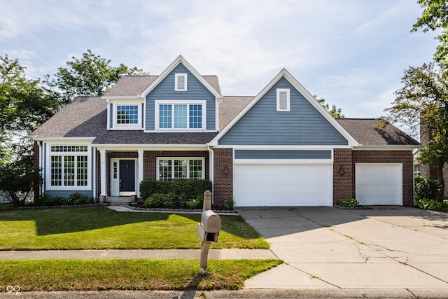 12861 Clifford Cir, Carmel, IN 46032 - view of front facade featuring a front yard, brick siding, an attached garage, concrete driveway, and a shingled roof