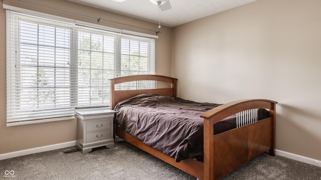 12861 Clifford Cir, Carmel, IN 46032 - carpeted bedroom with baseboards and ceiling fan