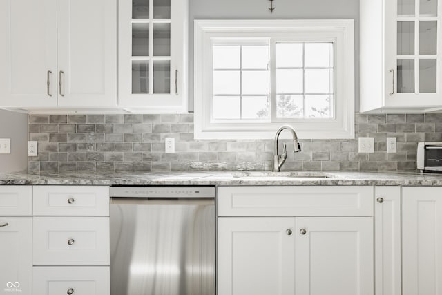 12861 Clifford Cir, Carmel, IN 46032 - kitchen featuring stainless steel dishwasher, white cabinetry, decorative backsplash, and light stone countertops