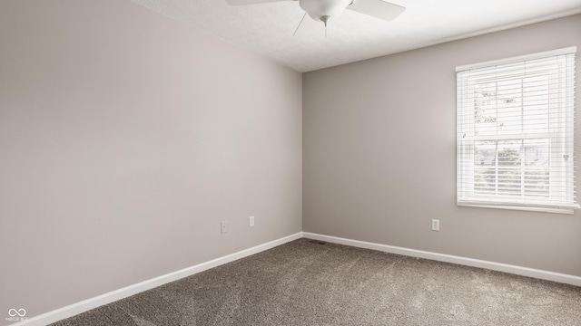 12861 Clifford Cir, Carmel, IN 46032 - empty room featuring ceiling fan and dark carpet
