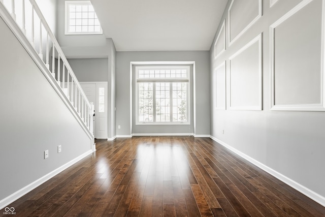 12861 Clifford Cir, Carmel, IN 46032 - foyer entrance with stairs, plenty of natural light, and dark wood-style floors