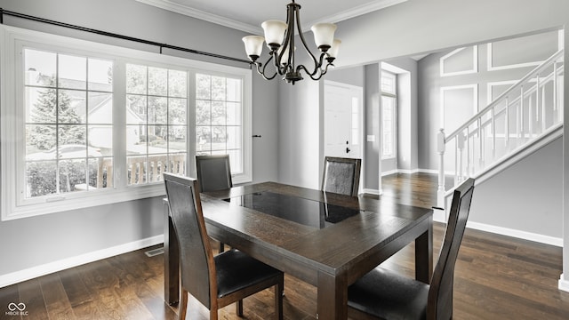 12861 Clifford Cir, Carmel, IN 46032 - dining room with a chandelier, ornamental molding, stairs, and dark wood-type flooring