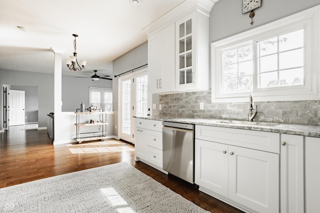 12861 Clifford Cir, Carmel, IN 46032 - kitchen featuring stainless steel dishwasher, tasteful backsplash, glass insert cabinets, and a chandelier