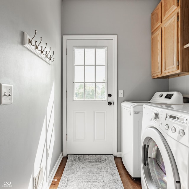 12861 Clifford Cir, Carmel, IN 46032 - laundry area featuring cabinet space, washing machine and dryer, and dark wood-type flooring