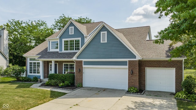 12861 Clifford Cir, Carmel, IN 46032 - view of front of house featuring concrete driveway, a front yard, a garage, brick siding, and a shingled roof