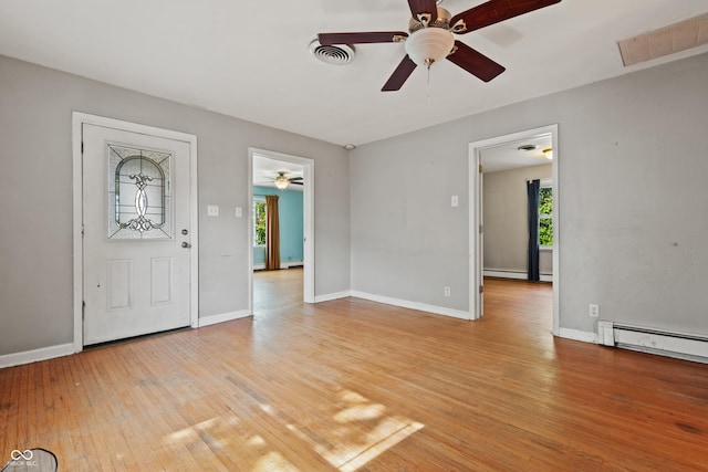 120 W N St, Tipton, IN 46072 - entryway featuring plenty of natural light, a ceiling fan, light wood-style floors, and a baseboard radiator