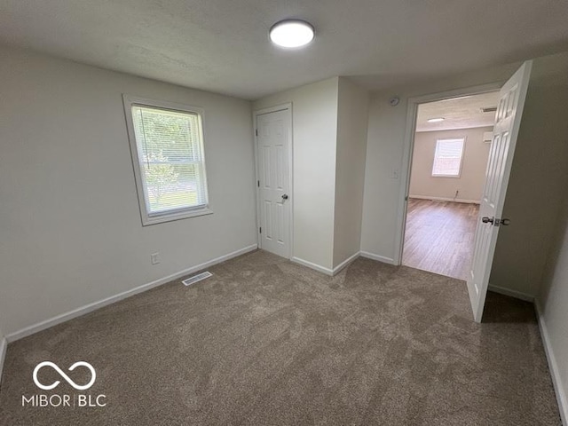 5725 N Clover Maple Dr, Fairland, IN 46126 - unfurnished bedroom featuring baseboards and carpet floors