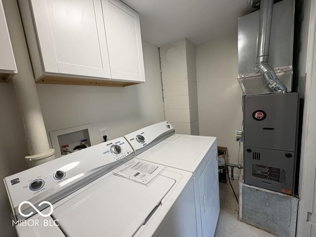 5725 N Clover Maple Dr, Fairland, IN 46126 - washroom with washing machine and dryer, cabinet space, and heating unit