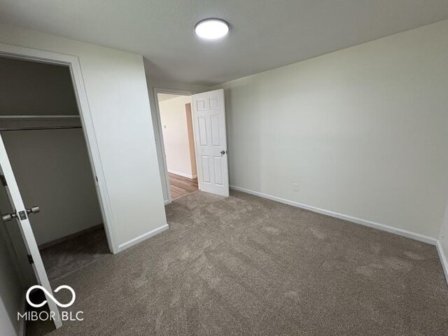5725 N Clover Maple Dr, Fairland, IN 46126 - unfurnished bedroom featuring carpet and a closet