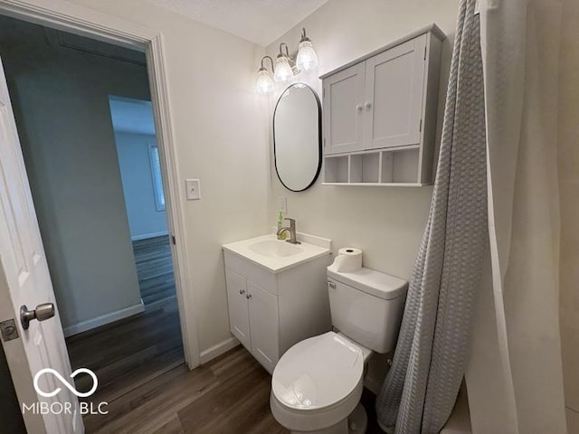 5725 N Clover Maple Dr, Fairland, IN 46126 - bathroom with wood finished floors, vanity, and a shower with curtain