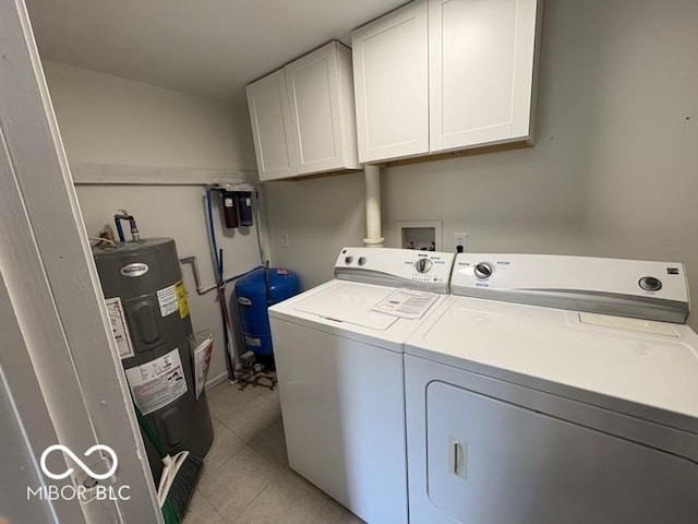 5725 N Clover Maple Dr, Fairland, IN 46126 - laundry area with water heater, washer and clothes dryer, cabinet space, and light tile patterned floors