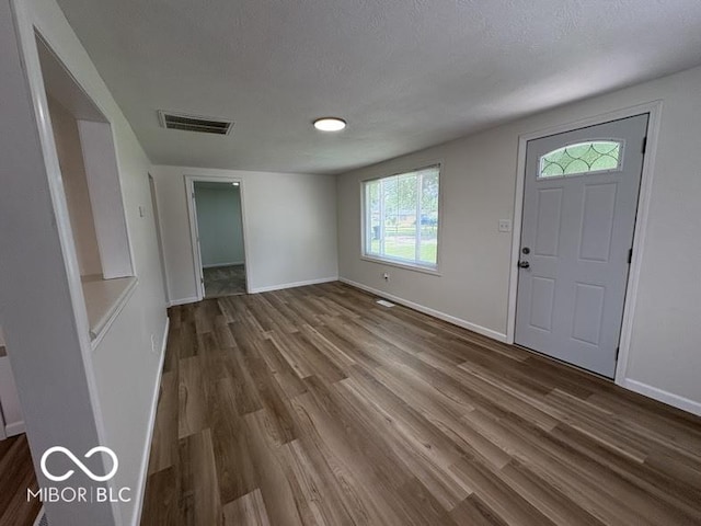 5725 N Clover Maple Dr, Fairland, IN 46126 - foyer entrance with dark wood-type flooring and baseboards