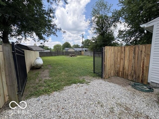 5725 N Clover Maple Dr, Fairland, IN 46126 - fenced backyard with a gate